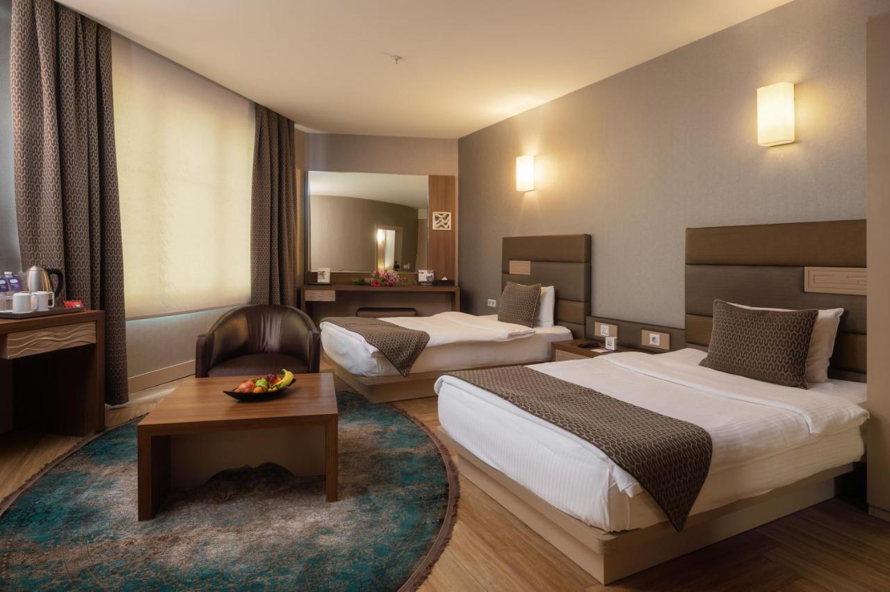 Titanic Hotel & Spa Sulaymaniyah Exterior photo A room at the hotel