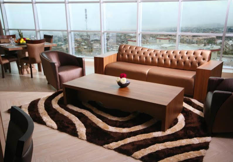 Titanic Hotel & Spa Sulaymaniyah Exterior photo A living room with a carpet